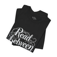 Load image into Gallery viewer, Read Between the Lines T-Shirt — Gothic Script Graphic Tee
