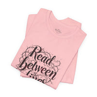 Load image into Gallery viewer, Read Between the Lines T-Shirt — Literary Quote Graphic Tee for Book Lovers