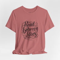 Load image into Gallery viewer, Read Between the Lines T-Shirt — Literary Quote Graphic Tee for Book Lovers