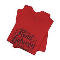 Load image into Gallery viewer, Read Between the Lines T-Shirt — Literary Quote Graphic Tee for Book Lovers
