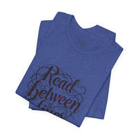 Load image into Gallery viewer, Read Between the Lines T-Shirt — Literary Quote Graphic Tee for Book Lovers