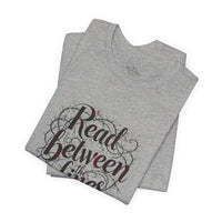 Load image into Gallery viewer, Read Between the Lines T-Shirt — Literary Quote Graphic Tee for Book Lovers