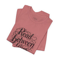 Load image into Gallery viewer, Read Between the Lines T-Shirt — Literary Quote Graphic Tee for Book Lovers