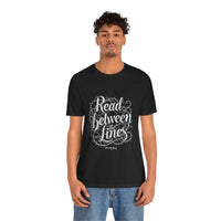 Load image into Gallery viewer, Read Between the Lines T-Shirt — Gothic Script Graphic Tee