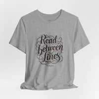 Load image into Gallery viewer, Read Between the Lines T-Shirt — Literary Quote Graphic Tee for Book Lovers