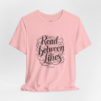 Load image into Gallery viewer, Read Between the Lines T-Shirt — Literary Quote Graphic Tee for Book Lovers